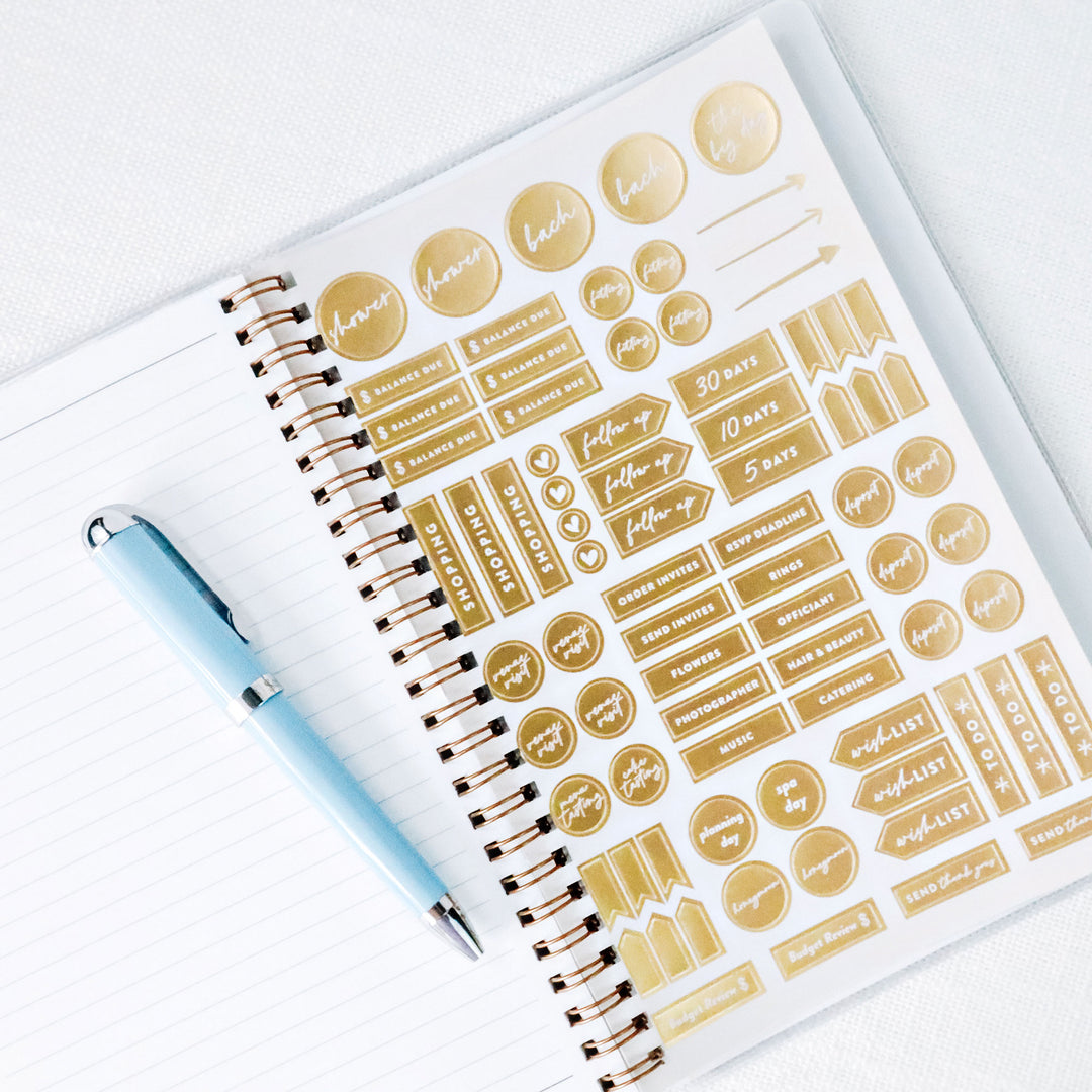 Each planner includes a gold foil wedding planning sticker sheet that is perfectly sized for the calendar boxes.