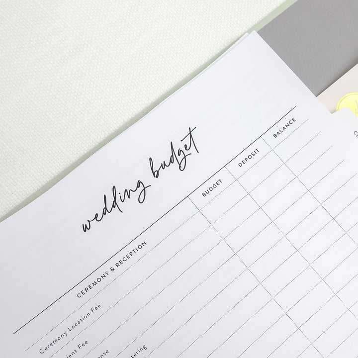 Our linen wedding planning binders include our comprehensive wedding planner full of handy worksheets like wedding budget