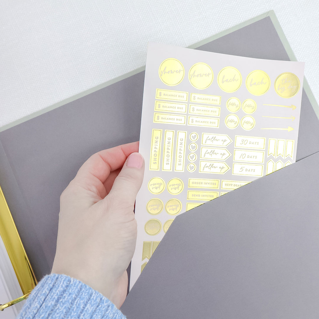 Our linen wedding binders also include a gold foil planning sticker sheet