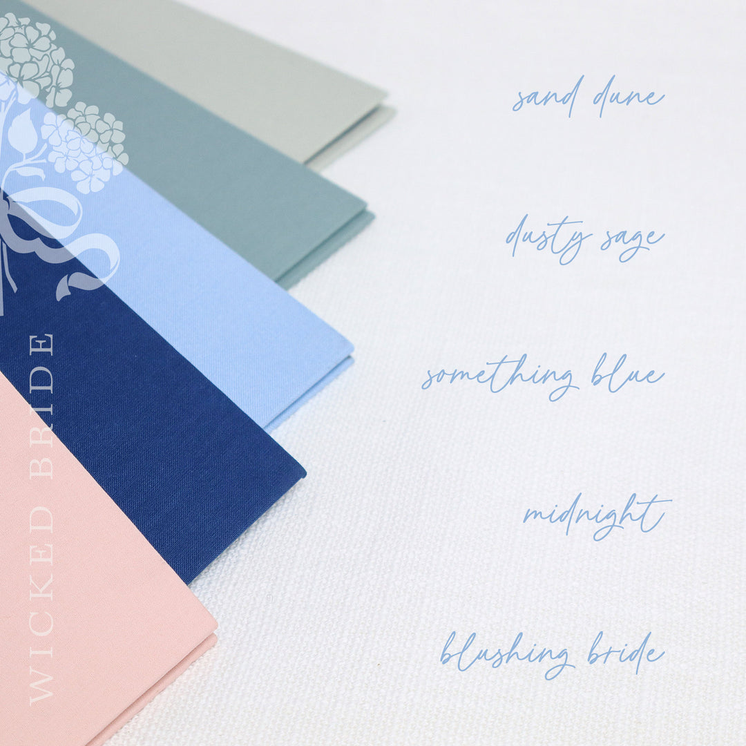 Our custom linen binders come in five different color options and each one includes our signature wedding planner and one inside pocket