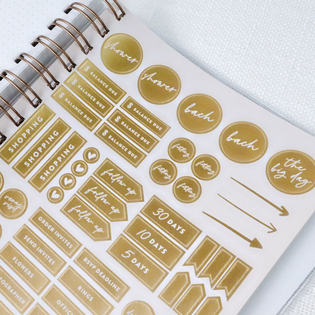 Each planner comes with a full sheet of gold foil wedding planning stickers.