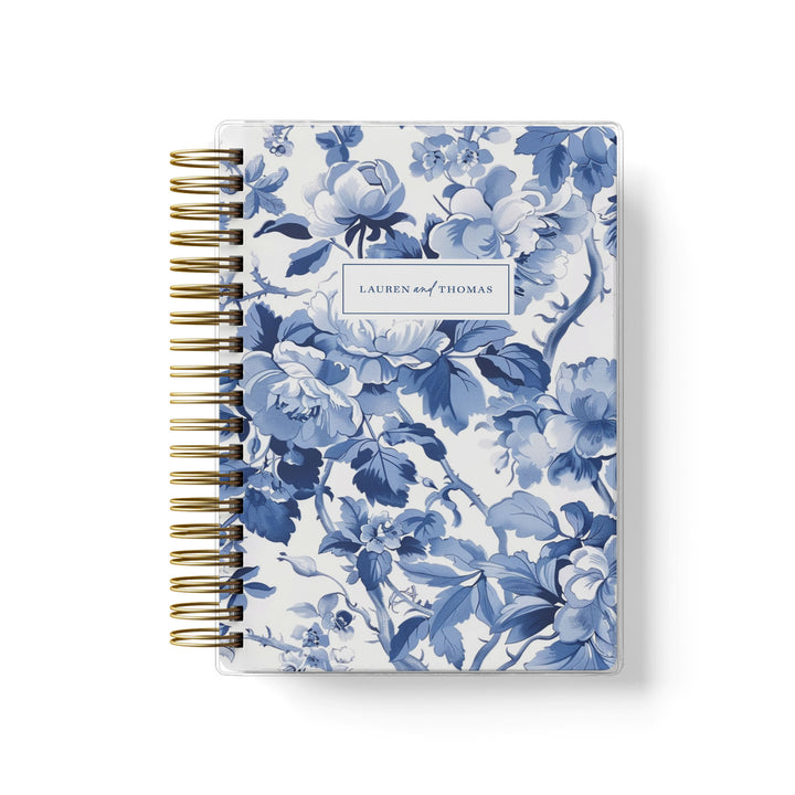 Our soft cover wedding planners are  the best option for brides on a budget, shown in our popular blue toile floral design.