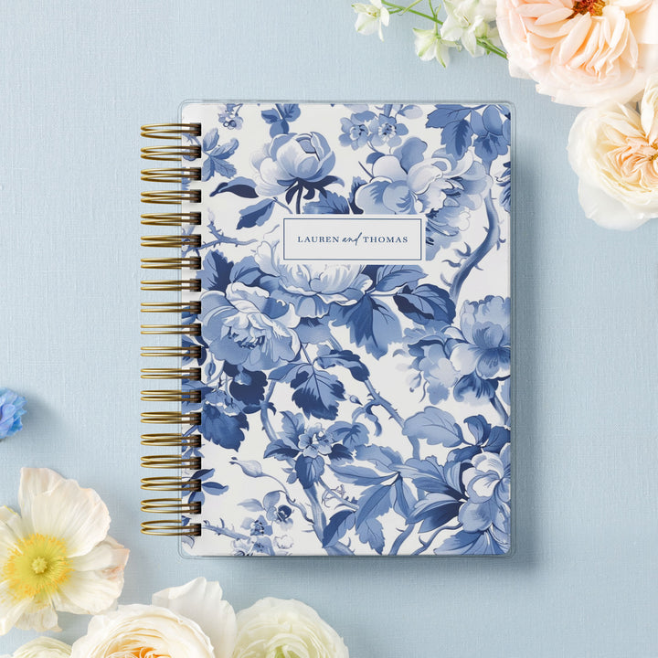 Our soft cover wedding planners are  the best option for brides on a budget, shown in our popular blue toile floral design.