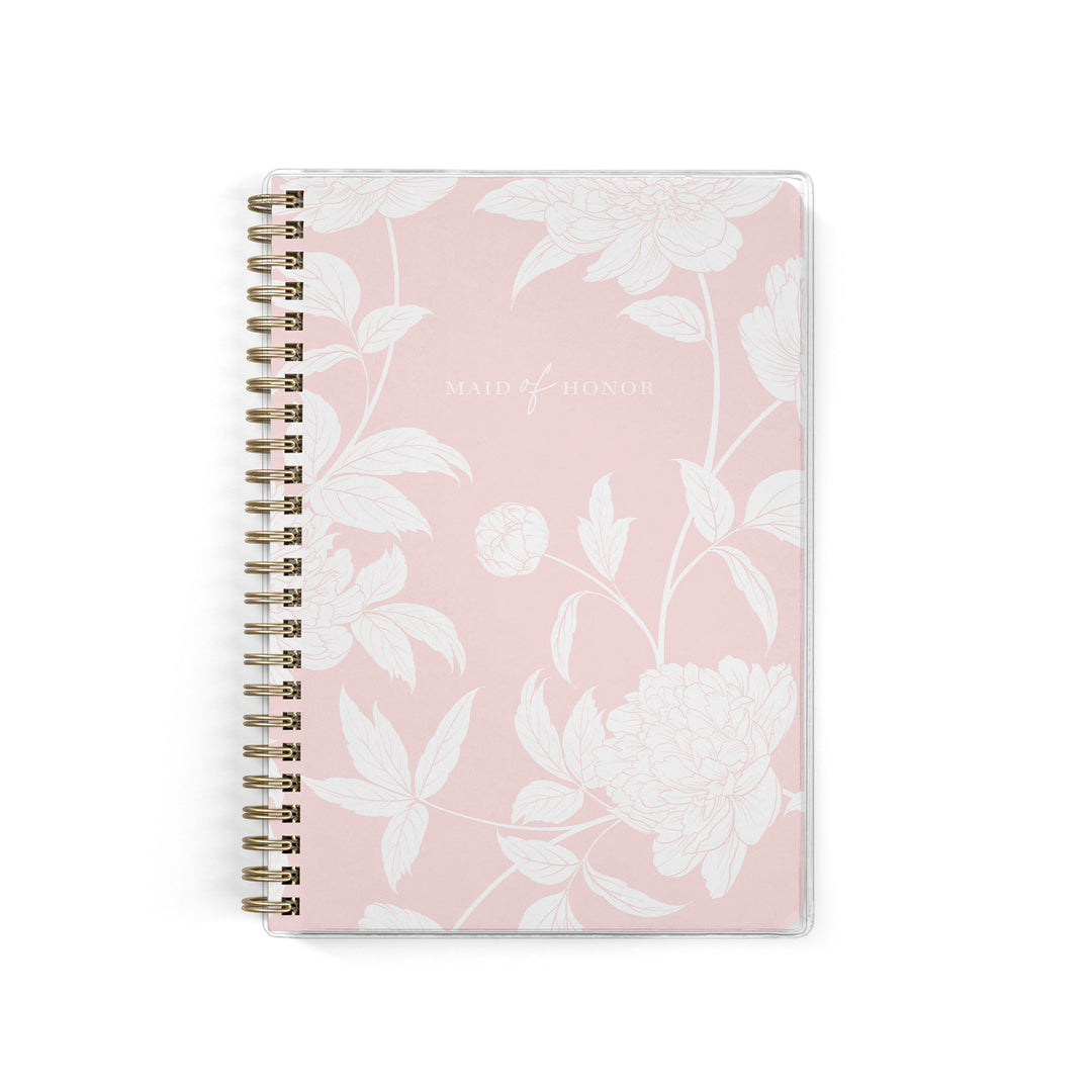 Our exclusive maid of honor planners are the perfect gift for your best friend, shown in a blush peony pattern