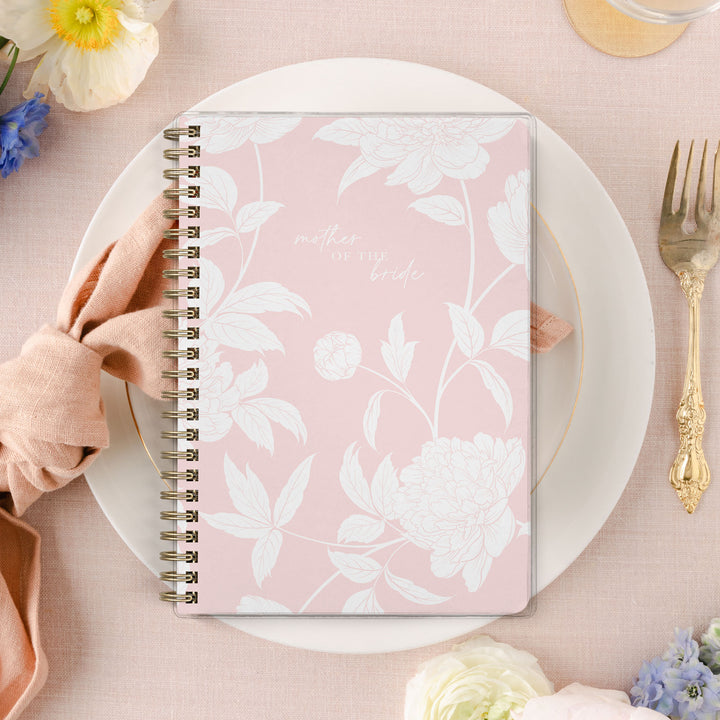 Shown in a blush peony print, Mother of the Bride planners are exclusive to Wicked Bride.