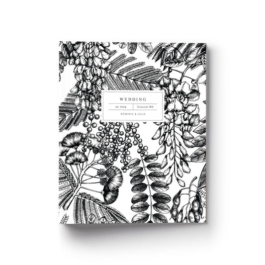 Our wedding binders are the perfect planning tool, shown in a black and white botanical print