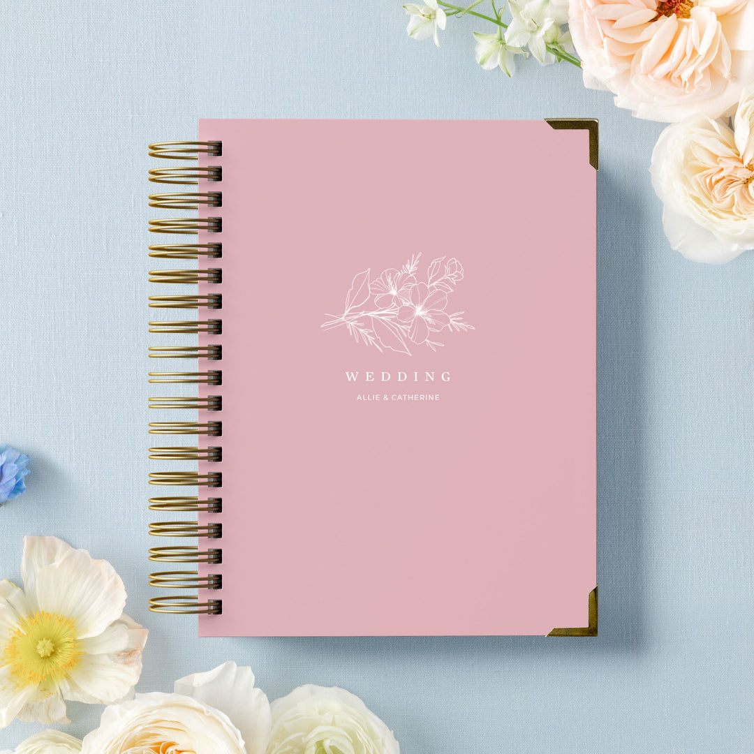 Our LGBT wedding planner books are all-inclusive and gender-neutral, shown in a delicate floral sprig design