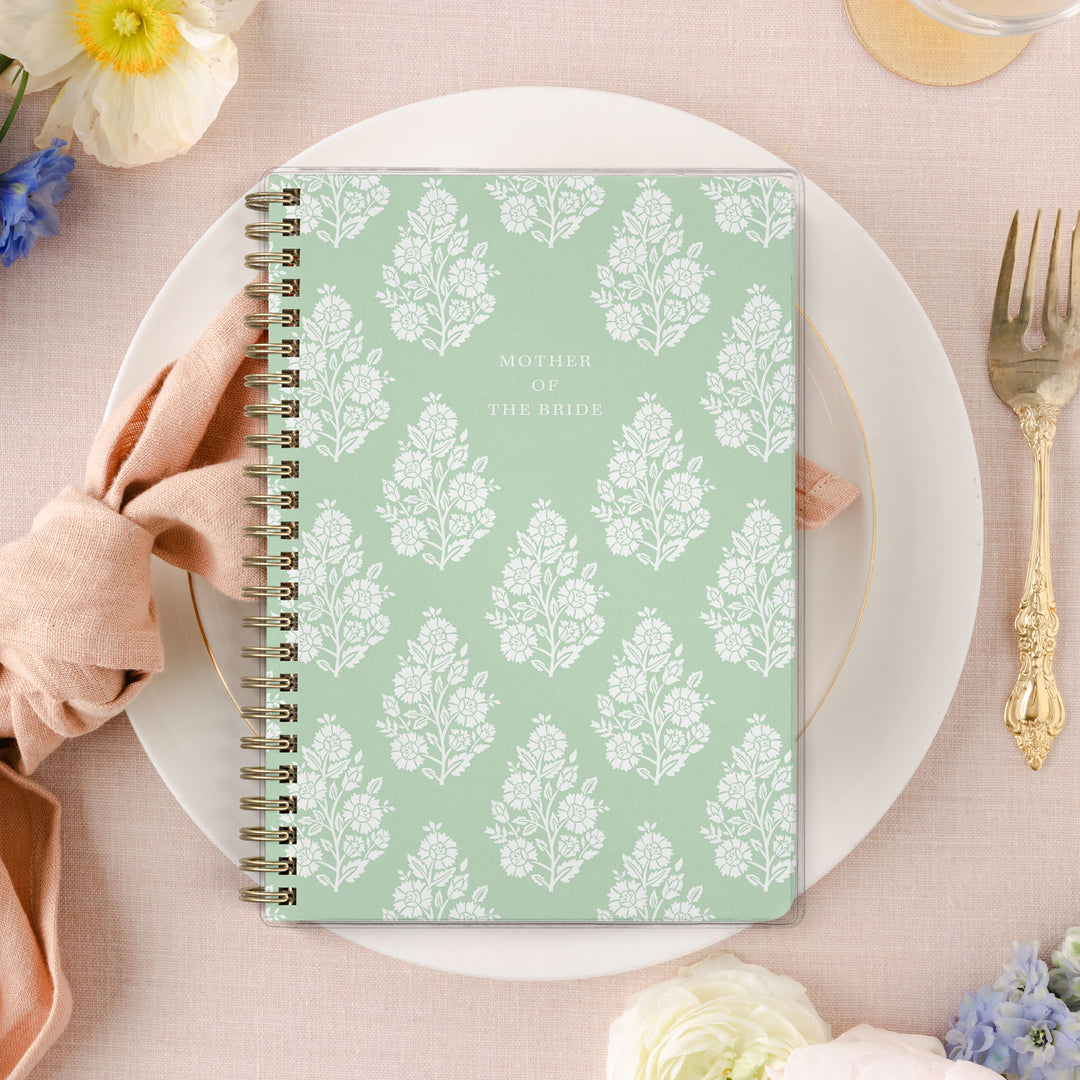 Shown in a fresh green floral block print, Mother of the Bride planners are exclusive to Wicked Bride.