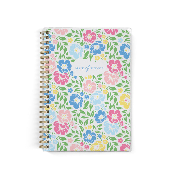 Our exclusive maid of honor planners are the perfect gift for your best friend, shown in a colorful garden floral design.