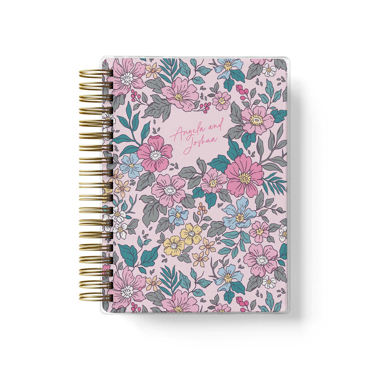 Our soft cover wedding planners are  the best option for brides on a budget, shown in colorful garden floral design.