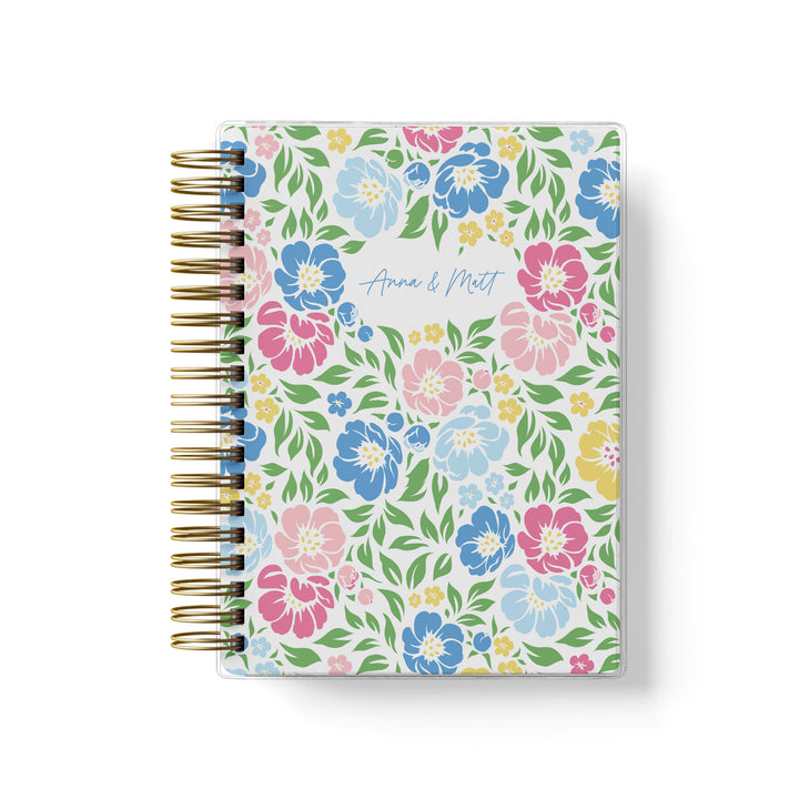 Our soft cover wedding planners are  the best option for brides on a budget, shown in colorful garden floral design.