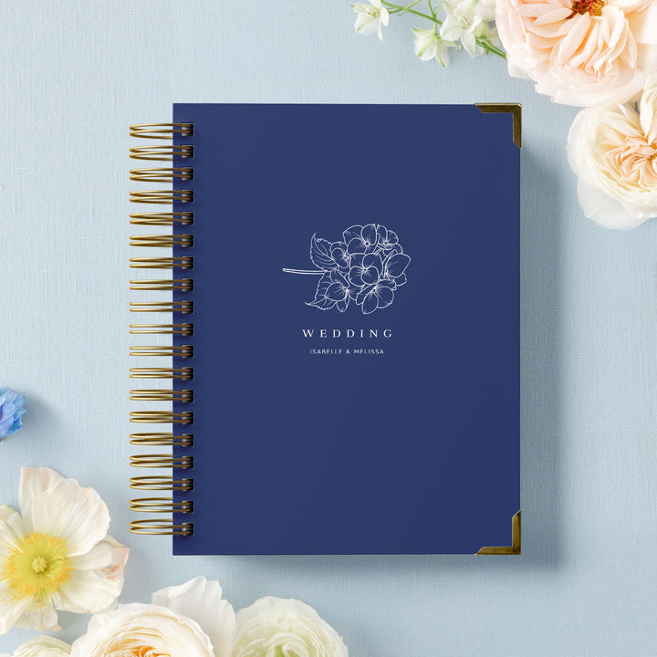 Our LGBT wedding planner books are all-inclusive and gender-neutral, shown in a hydrangea sprig design