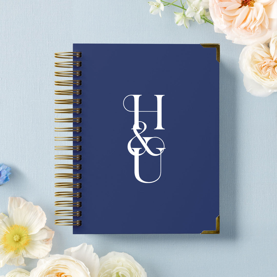 Our LGBT wedding planner books are all-inclusive and gender-neutral, shown in a bold monogram design