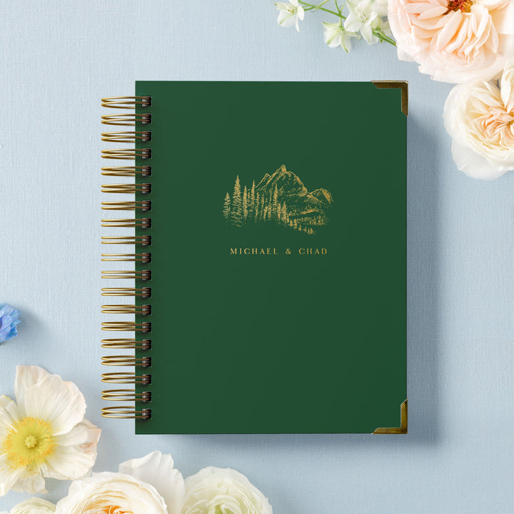 Our LGBT wedding planner books are all-inclusive and gender-neutral, design features a tree lined mountain vista