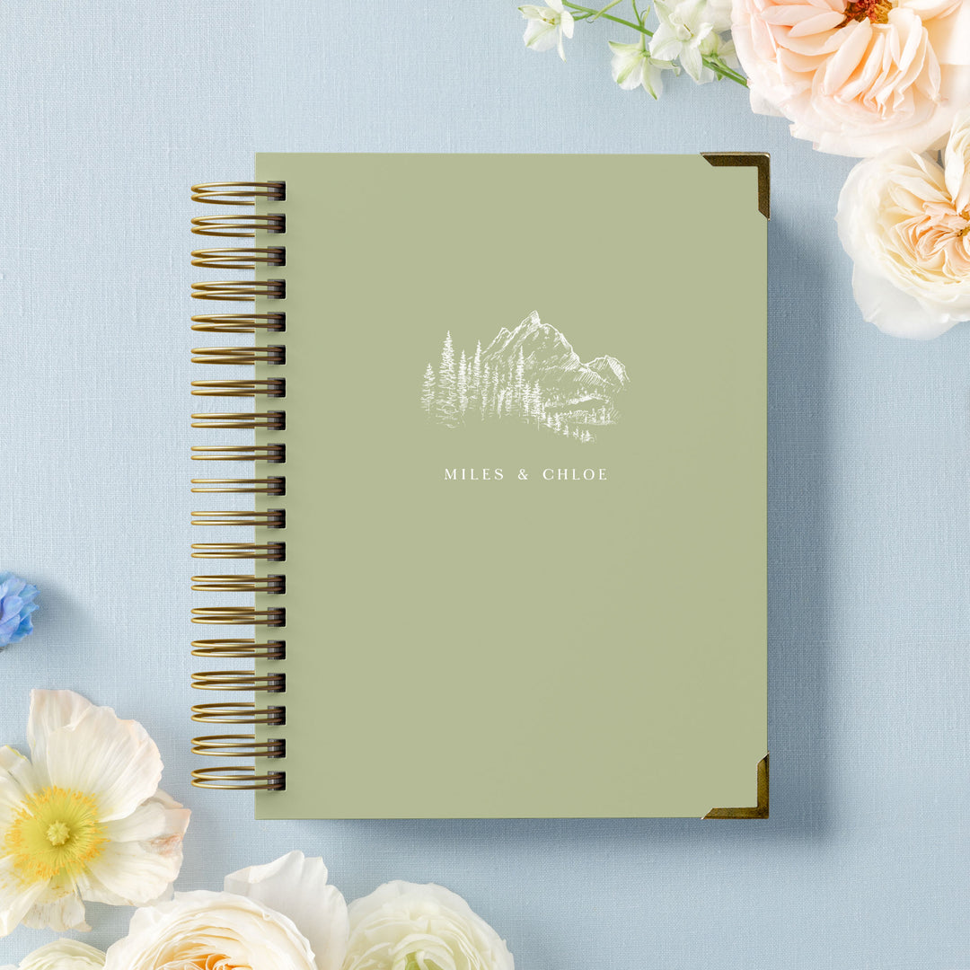 Our luxury wedding planner books are the best a bride can buy, featuring a mountain vista with trees design