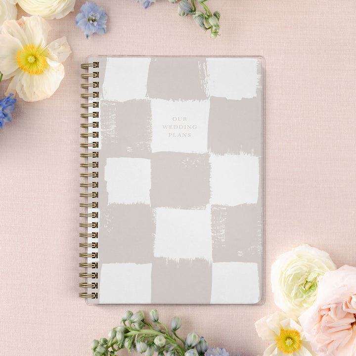 Our exclusive mini wedding planners are perfect for planning small weddings and elopements, shown in a neutral painted checkerboard pattern