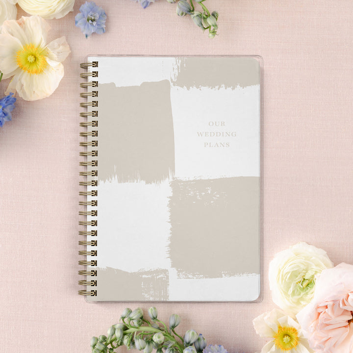 Our exclusive mini wedding planners are perfect for planning small weddings and elopements, shown in a neutral painted checkerboard pattern