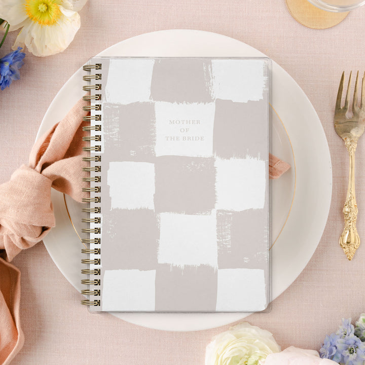 Shown in a neutral checkerboard pattern, Mother of the Bride planners are exclusive to Wicked Bride.