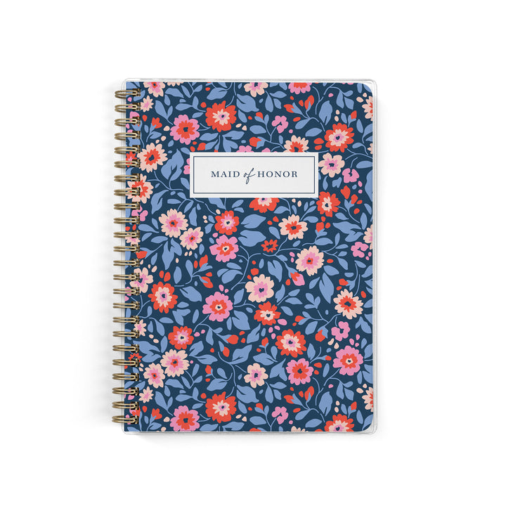 Our exclusive maid of honor planners are the perfect gift for your best friend, shown in a preppy red, pink and navy floral design.