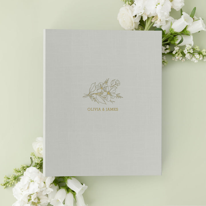 Our wedding binders are the perfect wedding planning tool, shown in a floral sprig design with the couple's first names