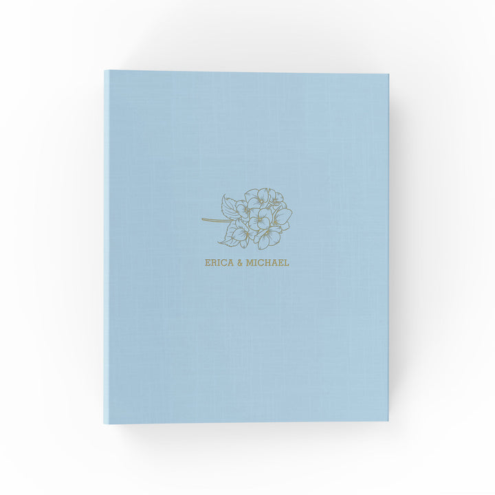 Our wedding binders are the perfect wedding planning tool, shown in a hydrangea design with the couple's first names