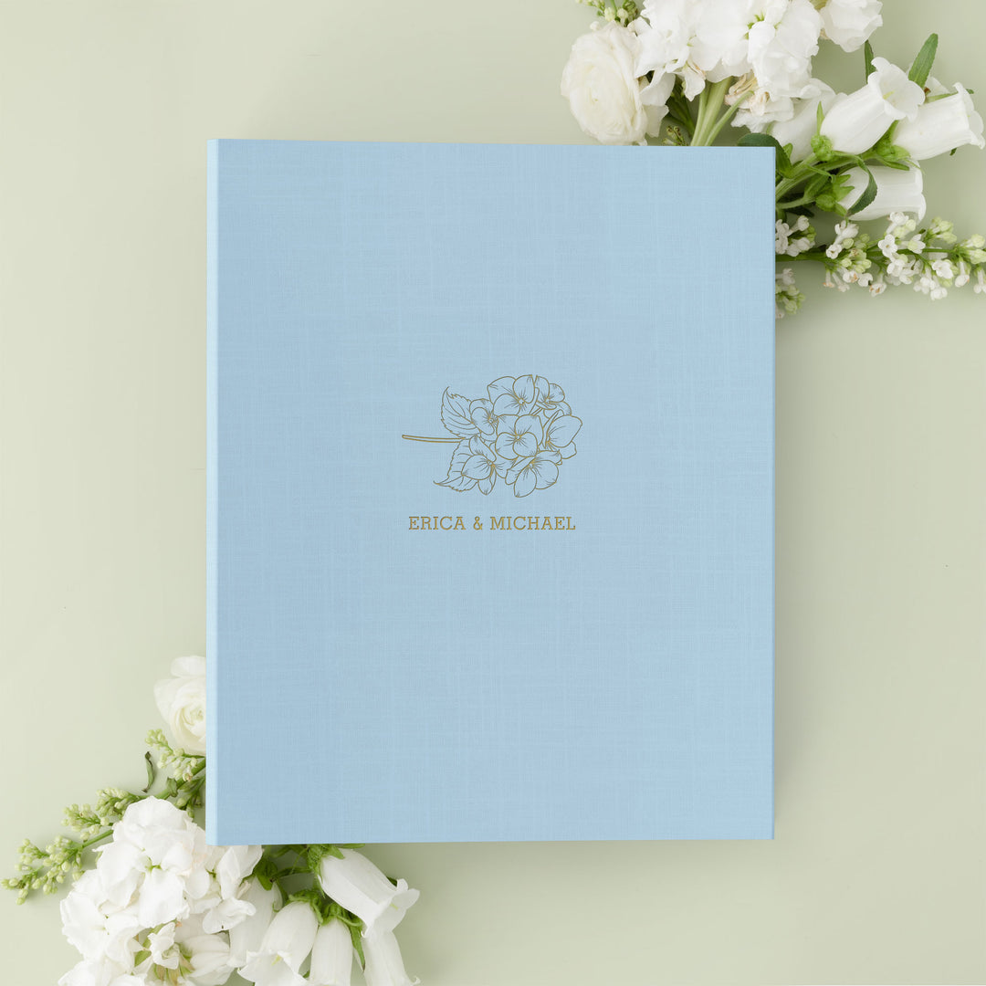 Our wedding binders are the perfect wedding planning tool, shown in a hydrangea design with the couple's first names