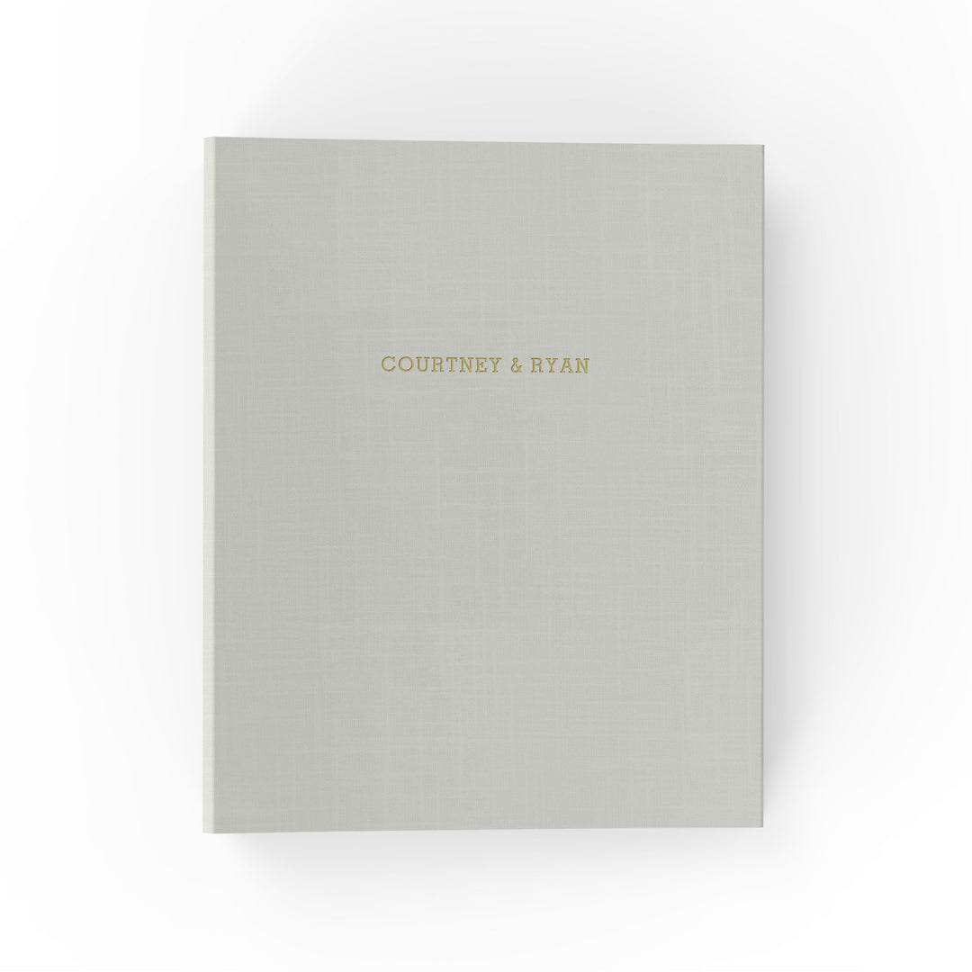 Our wedding binders are the perfect wedding planning tool, shown with the couple's first names on the cover