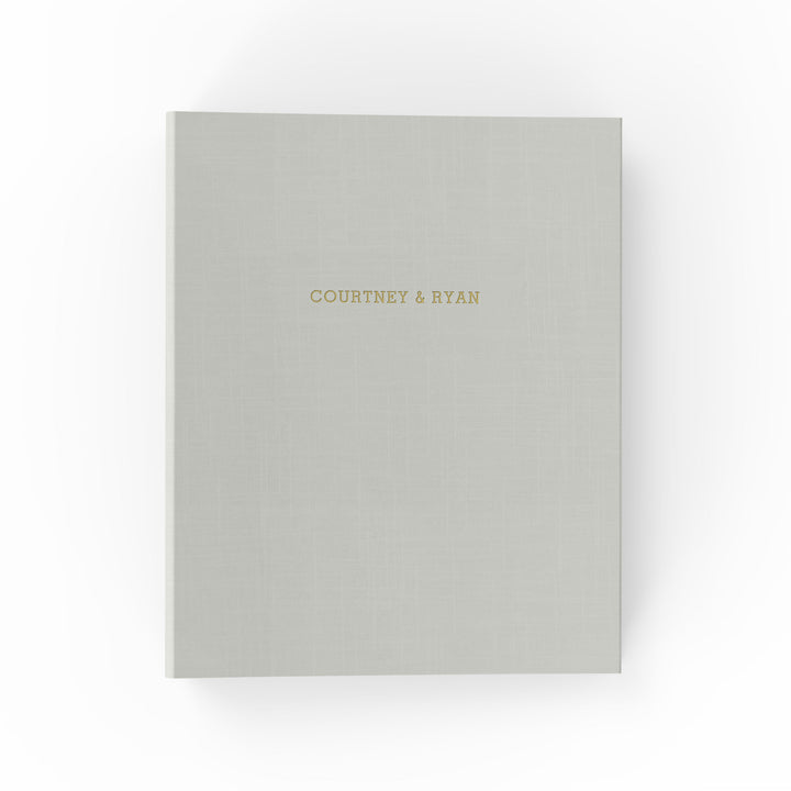 Our wedding binders are the perfect wedding planning tool, shown with the couple's first names on the cover