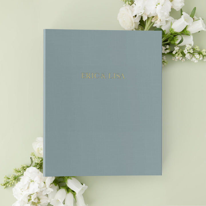 Our wedding binders are the perfect wedding planning tool, shown with the couple's first names on the cover